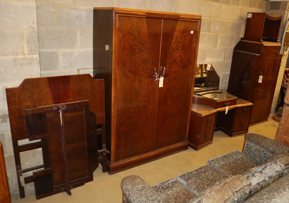 Two Art Deco style figured walnut wardrobes, a dressing table, a stool and a single bed frame, larger wardrobe W.118cm, D.50cm, H.182cm